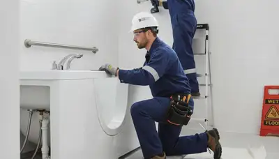 Charlotte, NC plumbers installing a walk-in tub for safer, accessible bathing in a home bathroom