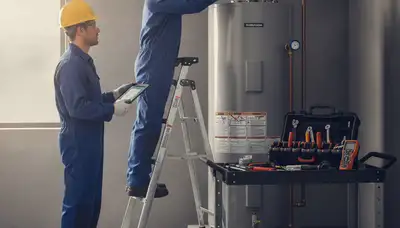 Charlotte NC plumber repairing a water heater for reliable home service